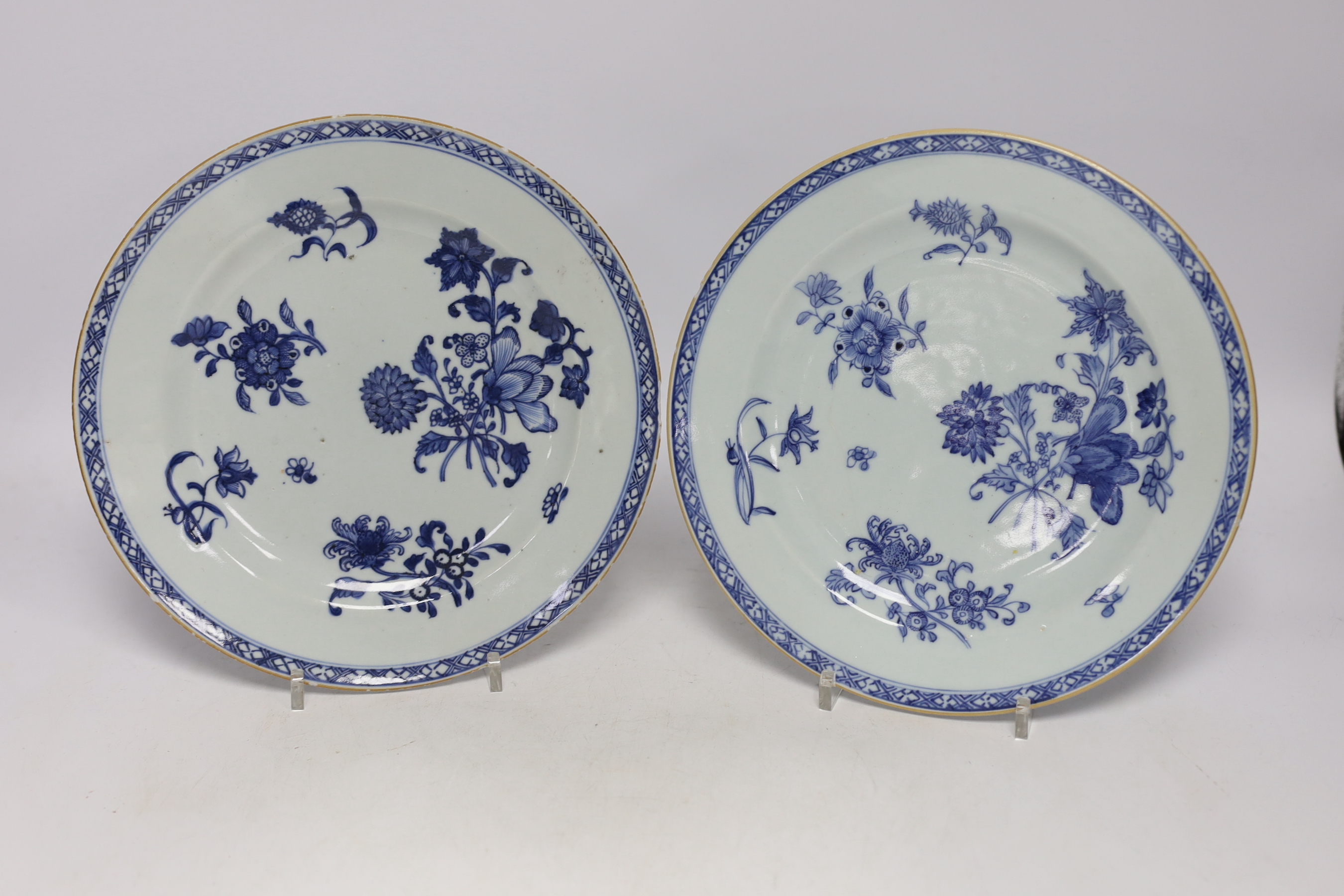 A Chinese 18th century reticulated double walled tea bowl and saucer, two blue and white plates and a jug (5)